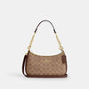 Teri Shoulder Bag
In Signature Canvas
